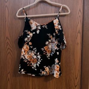 Black floral top with straps and loose sleeves